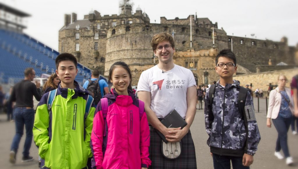 Beiwei guide with Chinese tourists in front of Edinburgh Castle