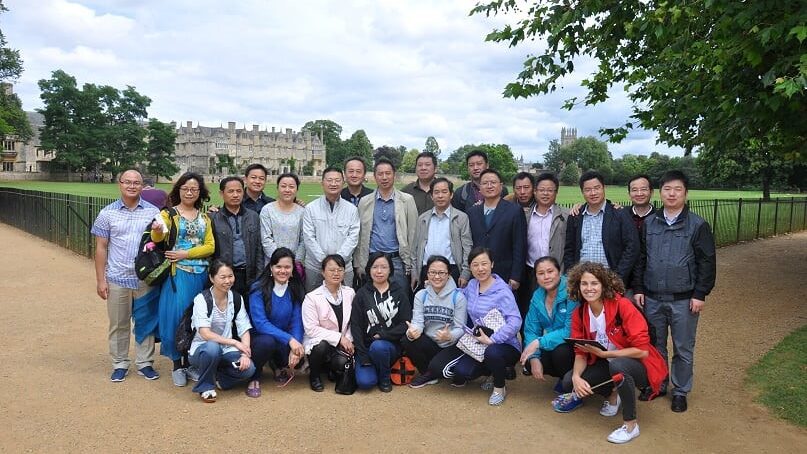A delegation from a Chinese organisation posing with a Beiwei Guide